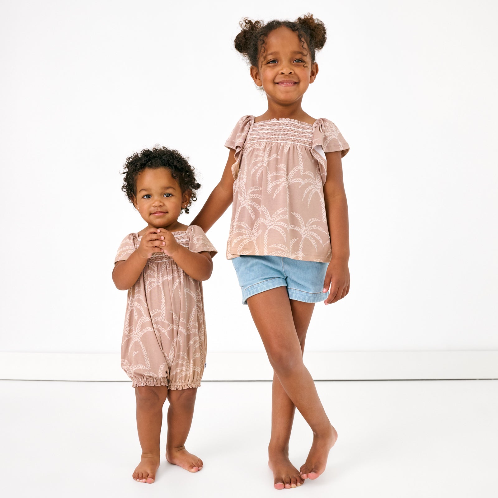 Sandy Palms Smocked Flutter Top